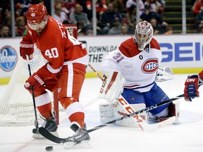 Montreal Canadiens goalie Carey Price (31) watches as Detroit Red Wings captain Henrik Zetterberg (40) controls the puck during the second period Monday, Feb. 16, 2015, in Detroit. (AP Photo/Carlos Osorio)