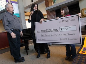 FILE: Lauren Baillargeon (right) is joined by her grandfather Dan Gerard (left) as she presents Houida Kassem (centre) with a cheque for the Windsor Essex Cancer Centre Foundation at Windsor Regional Hospital in Windsor on Friday, March 7, 2014. Baillargeon raised $3820 dollars after originally setting out to raise $50.                     (TYLER BROWNBRIDGE/The Windsor Star)
