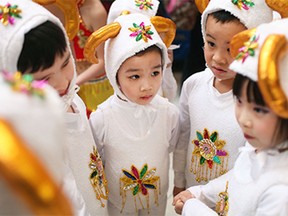 Young dancers play coconut while waiting to perform at a Chinese New Year celebration at Devonshire Mall, Sunday, Feb. 22, 2015.  The celebration was organized by the Essex County Chinese Canadian Association.  (DAX MELMER/The Windsor Star)