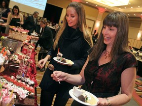 Sarah Klingbyle, left, and her mother, Cathy Klingbyle, load their plates with chocolate pastries at the 17th annual Chocolate Lovers Brunch at Caesars Windsor, Sunday, Feb. 8, 2015.  All proceeds from the event go towards the VON Windsor-Essex.  (DAX MELMER/The Windsor Star)