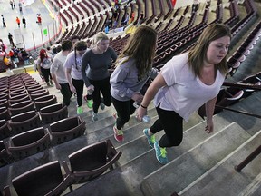 Over 2,000 climbers participated in the 6th annual iClimb for United Way event held at the WFCU Centre on Wednesday, Feb. 25, 2015, in Windsor, Ont. Students from local elementary and secondary schools, 20 workplaces and 150 volunteers took part in the event that raises money for mental health programs. A group of local students make their way up the stairs during the event. (DAN JANISSE/The Windsor Star)