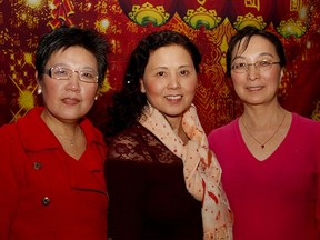 Members of the Chinese association from left to right, Julie Li, Dong Yan and Nancy Pang attend the Chinese New Year gala held at St. Clair Centre for the Arts, Saturday, Feb. 21, 2015. Hosted by the Chinese Association of Greater Windsor, the event rang in the year of the ram. (RICK DAWES/The Windsor Star)