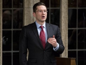 Minister of Employment and Social Development Pierre Poilievre responds to a question during Question Period in the House of Commons Monday February 16, 2015 in Ottawa. THE CANADIAN PRESS/Adrian Wyld