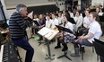 Robert Franz, Music Director with the WSO, works the the Assumption College Catholic High School band in Windsor on Thursday, February 12, 2015. Franz spent an hour with the students helping them to with technique. (TYLER BROWNBRIDGE/The Windsor Star)