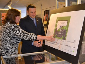 Jeff Watson (MP-Essex), right, and Lynn Calder, executive director Assisted Living Southwestern Ontario, look over plans on Friday, Feb. 13, 2015, for a new accessible transit entrance and parking area at the facility just before Watson made a funding announcement  at the North American Black Historical Museum in Amherstburg. JULIE KOTSIS/The Windsor Star