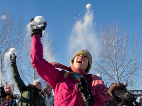 Participants hurl snowballs in Edmonton's mass snow fight of Dec. 7, 2014. (Jason Franson / Canadian Press)