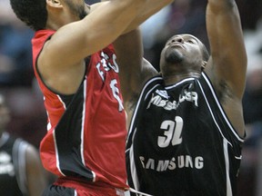 Windsor's Kevin Loiselle, left, takes a shot over Mississauga's Paul Cooper as the Windsor Express host the Mississauga Power at the WFCU Centre, Sunday, Feb. 22, 2015.  (DAX MELMER/The Windsor Star)