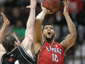 Windsor's Kevin Loiselle makes a power move to the basket while being defended by Mississauga's Michael Allison as the Windsor Express host the Mississauga Power at the WFCU Centre, Sunday, Feb. 22, 2015.  (DAX MELMER/The Windsor Star)