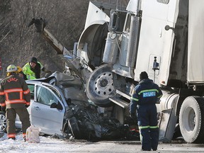 Ontario Provincial Police investigate a fatal head-on crash on the Arner Townline in Kingsville, ON. on Thursday, Feb 19, 2015.   (DAN JANISSE/The Windsor Star)