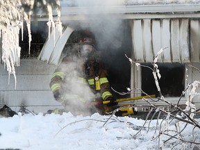 LaSalle Fire Services tend to a working house fire on the 600 block of Laurier Dr. in LaSalle, Sunday, Feb. 15, 2015. (DAX MELMER/The Windsor Star)