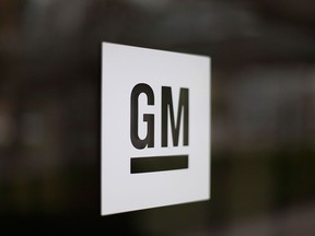 This Friday, May 16 2014, file photo, shows the General Motors logo at the company's world headquarters in Detroit. (AP Photo/Paul Sancya, File)