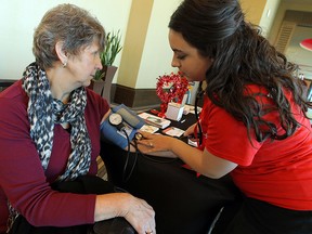 Rachel Klein checks Marg Van Patter's blood pressure during a Heart Month awareness event put on by the Heart and Stroke Foundation at Caesars Windsor on Friday, February 20, 2015. Free blood pressure checks, CPR lessons and information were provided during the event. (TYLER BROWNBRIDGE/The Windsor Star)