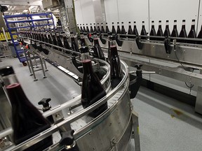 Bottles of cherry whisky roll down the line during the official opening of the new bottling line at Hiram Walker & Sons distillery in Windsor on Friday, February 6, 2015. (TYLER BROWNBRIDGE/The Windsor Star)