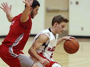 Essex District High School's Nik Veiali (right) tries to cut around F.J. Brennan Catholic High School's Pren Duhanet at Essex District High School on Friday, February 20, 2015. (TYLER BROWNBRIDGE/The Windsor Star)