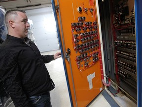 Karl Lovett looks at an electrical panel removed from the Windsor Assembly Plant which is used by IBEW electricians training prior to starting their work on the Windsor Assembly Plant in Windsor on Friday, February 13, 2015.  (TYLER BROWNBRIDGE/The Windsor Star)