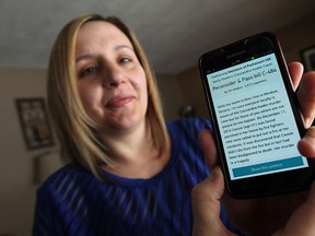 Kim Badour is photographed with a copy of her online petition at her home in Windsor on Wednesday, February 11, 2015. Badour is trying to change the law to recognize unborn children in cases where pregnant woman are killed.  (TYLER BROWNBRIDGE/The Windsor Star)