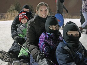 The Zvaniga family, from front to back, Ryan, Brooke, Lisa, Kyle, and Jeff go tobogganing at Malden Park for Light Up the Night, Saturday, Jan. 31, 2015.  (DAX MELMER/The Windsor Star)