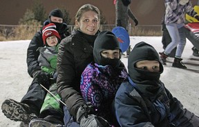 The Zvaniga family, from front to back, Ryan, Brooke, Lisa, Kyle, and Jeff go tobogganing at Malden Park for Light Up the Night, Saturday, Jan. 31, 2015.  (DAX MELMER/The Windsor Star)