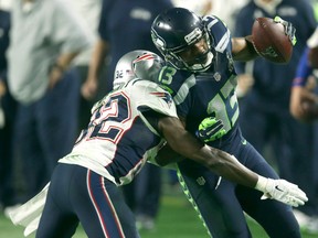 Devin McCourty #32 of the New England Patriots is tackles  Chris Matthews #13 of the Seattle Seahawks in the third quarter during Super Bowl XLIX at University of Phoenix Stadium on February 1, 2015 in Glendale, Arizona.  (Photo by Stephen Dunn/Getty Images)