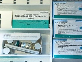 This Thursday, Jan. 29, 2015, file photo, shows boxes of the measles, mumps and rubella virus vaccine (MMR) and measles, mumps, rubella and varicella vaccine inside a freezer at a doctor's office in Northridge, Calif. (AP Photo/Damian Dovarganes, File)