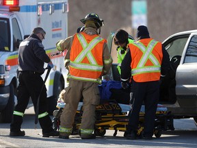 Emergency personnel tend to a three-car motor vehicle accident on Division Rd. west of Woodward Blvd. Monday, Feb. 23, 2015. (DAX MELMER/The Windsor Star)