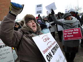Gail Edracher joins other CCAC nurses as they hold a rally in front of Windsor Regional Hospital Met Campus in Windsor on Tuesday, February 3, 2015. (TYLER BROWNBRIDGE/The Windsor Star)