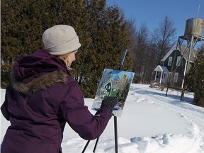 Wendy Matassa braves the cold as she paints at the Canadian Transportation Museum & Heritage Village near Essex on Thursday, February 19, 2015.      (TYLER BROWNBRIDGE/The Windsor Star)