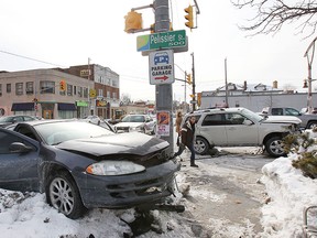 A two-car accident shut down Pelissier St. in Windsor, ON. on Monday, Feb. 16, 2015, at Wyandotte Ave. W. The accident occurred at approximately 2:30 p.m. and injuries were not life threatening. (DAN JANISSE/The Windsor Star)