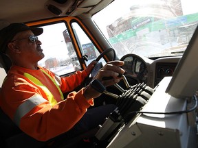 Snowplough operator George Thomas ploughs the streets of Windsor following a massive snow storm on Monday, February 2, 2015.  (TYLER BROWNBRIDGE/The Windsor Star)