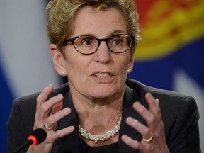 Ontario Premier Kathleen Wynne responds to a question during the closing press conference following Canada's premiers meeting in Ottawa on Friday, January 30, 2015. THE CANADIAN PRESS/Sean Kilpatrick
