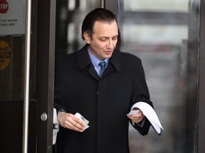 Dr. Charles Nicholas Rathe leaves the Superior Court of Justice in Windsor, ON. on Tuesday, Feb. 24, 2015 after being found not guilty on a public mischief charge. (DAN JANISSE/ The Windsor Star)