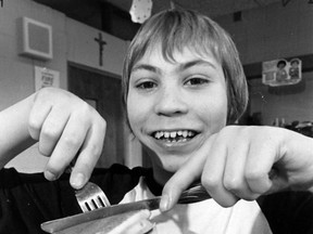 Paul Pinsonneault, a student at Notre Dame School, digs into pancakes for Shrove Tuesday on March 6, 1984. (TIM McKENNA/The Windsor Star)