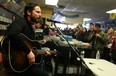 Members of the Sam Roberts Band perform at Dr. Disc, Sunday, Feb. 15, 2014.  Approximately 70 people crammed the record store to hear three songs and have autographs signed. (DAX MELMER/The Windsor Star)