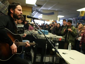 Members of the Sam Roberts Band perform at Dr. Disc, Sunday, Feb. 15, 2014.  Approximately 70 people crammed the record store to hear three songs and have autographs signed. (DAX MELMER/The Windsor Star)