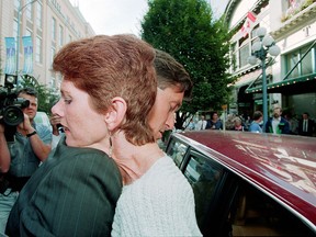 Sue Rodriguez is supported by MP Svend Robinson as he helps her out of a car on the way to a press conference in Victoria, B.C., Sept. 30, 1993. An advocate for doctor-assisted suicide is celebrating the Supreme Court of Canada decision on doctor-assisted suicide by remembering the British Columbia woman whose cause he championed more than 20 years ago, when she took her dying breath. THE CANADIAN PRESS/Ward Perrin