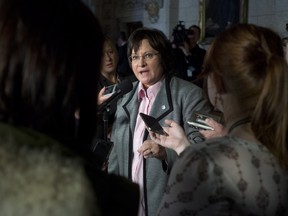 NDP Justice critic Francoise Boivin reacts to the Supreme Court of Canada decision on assisted suicide following question period on Parliament Hill in Ottawa on Friday, February 6, 2015. THE CANADIAN PRESS/Adrian Wyld