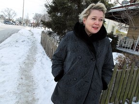 Angela Fitzpatrick is seen next to the sidewalk in front of her home on Church Street in Windsor on Thursday, February 19, 2015. Fitzpatrick is upset the city pushed the snow from the street back on to her sidewalk and she doesn't want to clear it.     (TYLER BROWNBRIDGE/The Windsor Star)