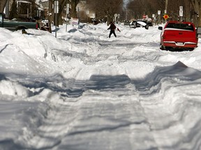 Side streets were hard to pass after a massive snow storm in Windsor on Monday, February 2, 2015.  (TYLER BROWNBRIDGE/The Windsor Star)