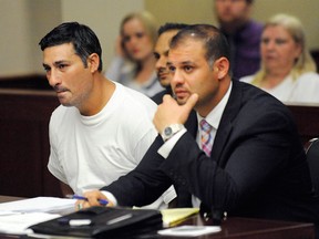 FILE- In this July 10, 2014, file photo, Bassel Abdul Saad, left, sits with his attorney Ali Hammoud, during his arraignment before Judge Kathleen McCann in the 16th District Court in Livonia, Mich. Saad, who is charged in the one-punch killing of referee John Bieniewicz during a game, has agreed to a plea deal with prosecutors in which he would serve 8-15 years in prison. (AP Photo/Detroit News, David Coates, File)