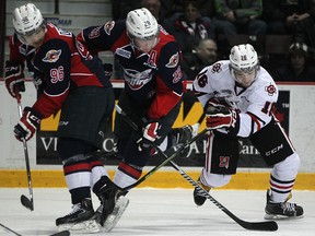 Windsor's Cristiano DiGiacinto, left, and Slater Doggett battle for the puck with Niagara's Mitchell Fitzmorris in OHL action at the WFCU Centre, Sunday, Feb. 15, 2014.  (DAX MELMER/The Windsor Star)
