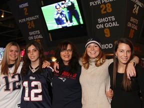 Super Bowl fans from left to right, Lisa Bradley, Nicole Bradley, Silvia Bradley, Hillary Marshall and Lauren Bradley cheer on the New England Patriots Sunday, Feb. 1, 2015 at Stars of the Game Bar and Grill in Lasalle. Along with Super Bowl XLIX, Silvia also celebrated her 54th birthday. (RICK DAWES/The Windsor Star)