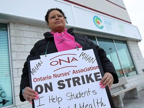 Tanya Rauls is photographed outside the CCAC office in Windsor on Friday, February 13, 2015. Rauls claims she has heard from the principal of the school she works in that the students she normally works with are struggling because of the strike.  (TYLER BROWNBRIDGE/The Windsor Star)