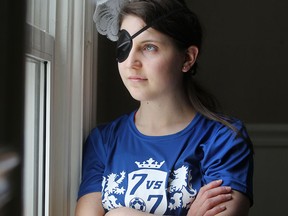 Robyn Young, 24, pictured at her home Friday, Feb. 20, 2015, had a brain tumour removed last year and is heading to Victoria, B.C. to receive vision rehabilitation. (DAX MELMER/The Windsor Star)