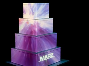 The mutli-tiered wedding cake "becomes the canvas for the projection" of Marz's 3D cake, says Adam Marz.