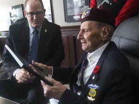First Special Service Forces Canadian Army veteran Ralph Mayville, right, is shown on Friday, Feb. 6, 2015, with Windsor Mayor Drew Dilkens during a media conference. Mayville's unit recently received the United States Congressional Gold Medal in Washington D.C.  (DAN JANISSE/The Windsor Star)