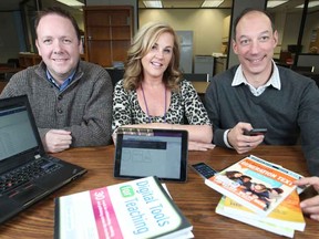 Chris Knight, left, teacher consultant for technologies and learning, is joined by Kelly Moore, centre, and Bruno Pallotto, both digital Learn Team facilitators for the GECDSB, on Friday, Feb. 6, 2014.  The school board is rolling out a new classroom digital technology program meant to keep school relevant to increasingly tech savvy students. (DAX MELMER/The Windsor Star)