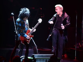 Billy Idol, right, plays in Detroit on Friday, Feb. 6. (Theo Wargo / Getty Images)