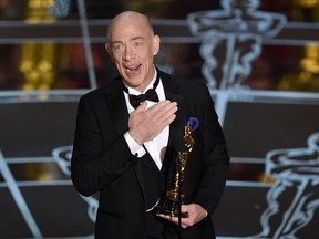 J.K. Simmons accepts the award for best actor in a supporting role for Whiplash at the Oscars on Sunday, Feb. 22, 2015, in Los Angeles. (John Shearer / Invision / AP)