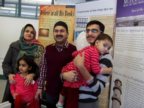 Amtal Tahira, left, with her daughter Sarah Ahmad, husband Waseem Kaleem, centre, son Aleem Aleem and daughter Sanaa, right,   arrive at Ahmadiyya Muslim Community Windsor Branch for an open house where the public was invited to meet and greet area Muslim families Sunday March 01, 2015. (NICK BRANCACCIO/The Windsor Star)