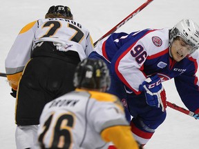 Spits Cristiano DiGiacinto, right, catches Sarnia's Stephen Pierog with a hip check in second period OHL action at WFCU Centre Sunday March 01, 2015. (NICK BRANCACCIO/The Windsor Star)